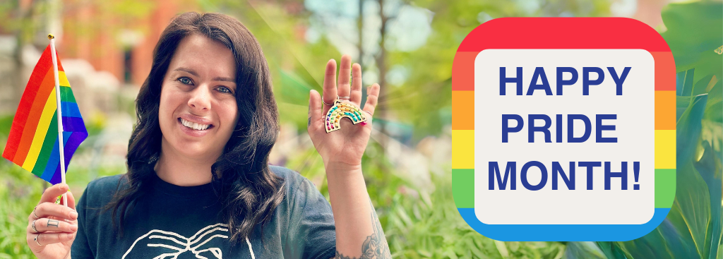 A WOMAN HOLDING A RAINBOW KEYCHAIN