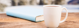 photo of a book and a mug